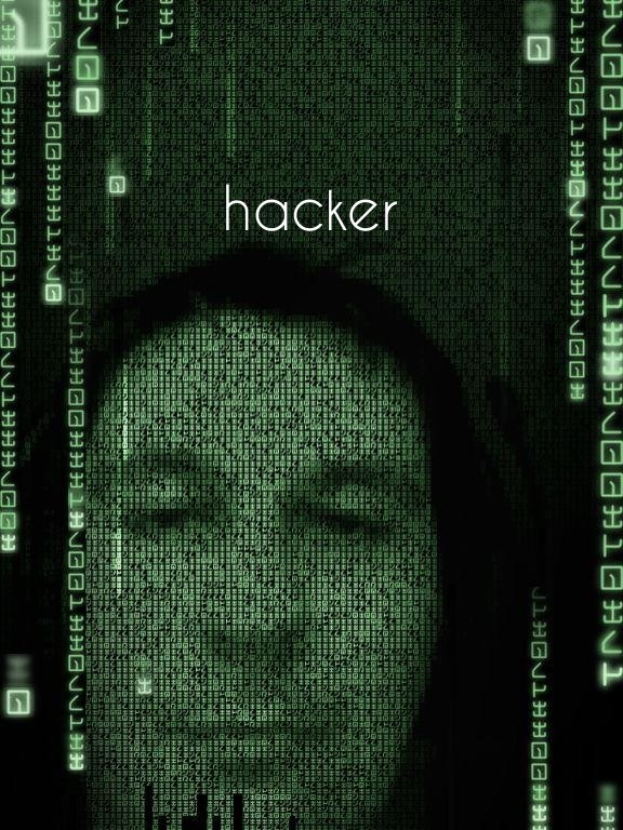 Das Gesicht eines Hackers auf einem Computerbildschirm mit dem Wort "Hacker" und Binärcode drumherum.