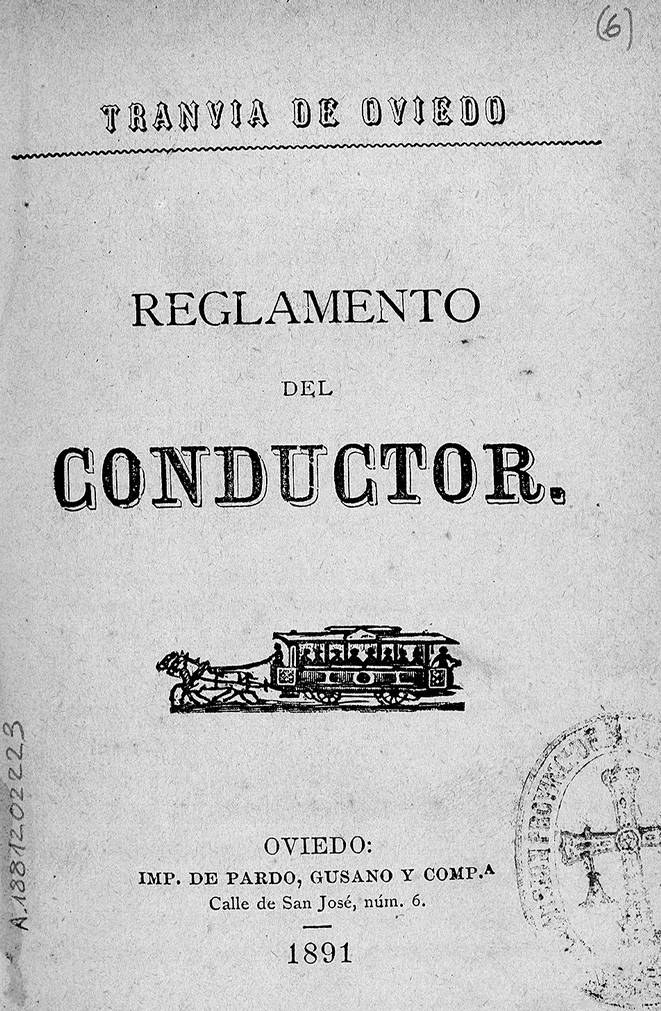 Altes Buch mit dem Titel 'Reglamento de Conductor' mit einer Zugillustration auf dem Cover und einem Stempel auf der rechten Seite.