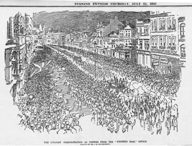 Schwarze und weiße Zeichnung einer Menge, die eine Straße zwischen Gebäuden entlanggeht, mit Text oben und unten, der "Die Unionistendemonstration aus der Sicht der Western Mail Office" lautet.
