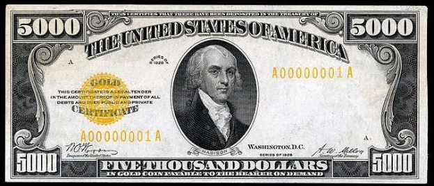 Eine US-amerikanische Fünftausend-Dollar-Note mit einem Porträt von George Washington, auf der 'United States' und 'Fünftausend Dollar' in fetter Schrift auf einem schwarzen Hintergrund zu sehen sind.
